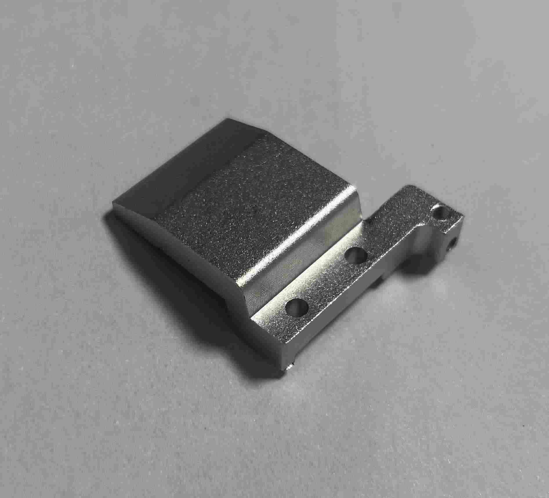 Custom aluminum fixture or jig, machined to hold parts securely during manufacturing or inspection processes.