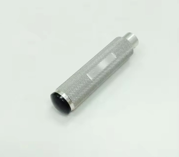 CNC turned aluminum knob with knurled grip for user interfaces and mechanical adjustments.