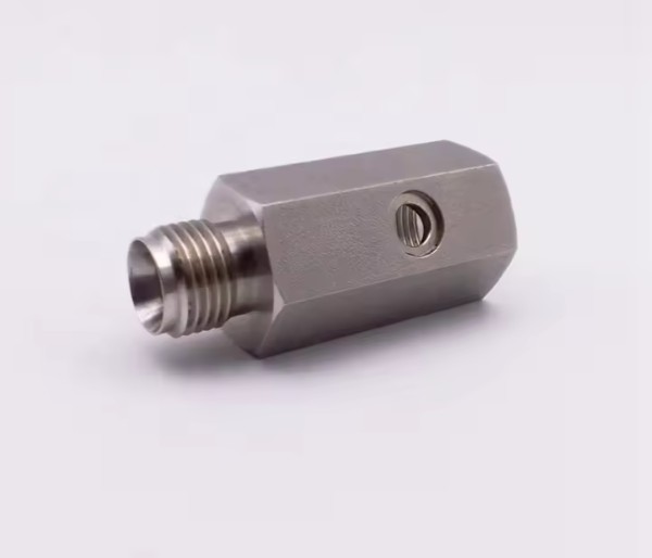 steel motor end bell or housing with mounting holes, turned and drilled on a CNC lathe.