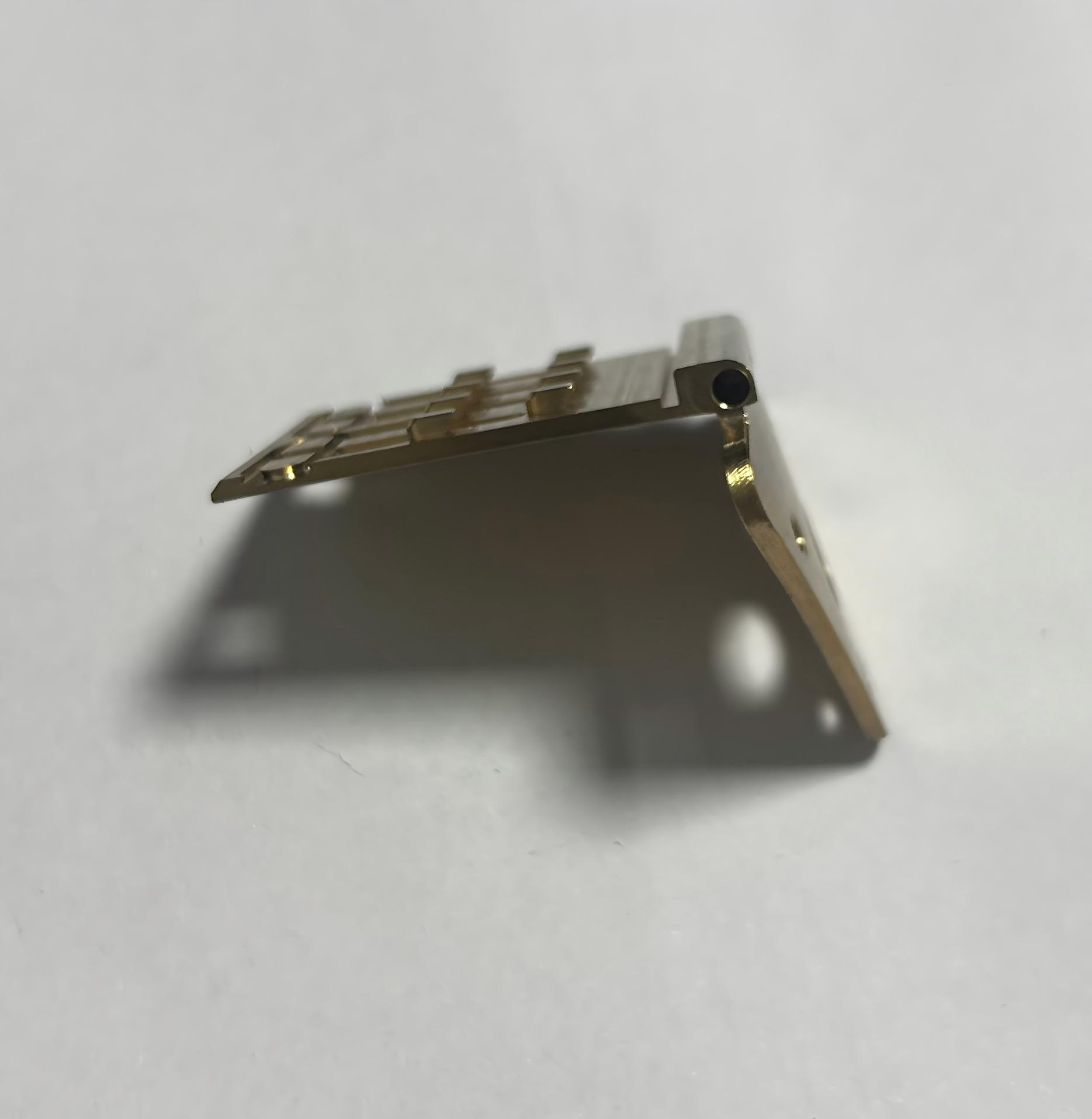 Intricate copper heatsink or support frame, designed for efficient thermal management in high-power electronic devices.