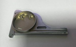 Ergonomic aluminum handle or grip with a complex contoured shape. Features various custom surface finishes for enhanced aesthetics and grip.