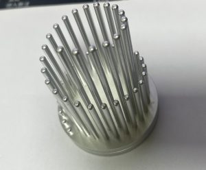 Modern cylindrical pen holder made from CNC-machined aluminum with vertical pillar design