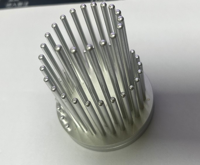 Modern cylindrical pen holder made from CNC-machined aluminum with vertical pillar design