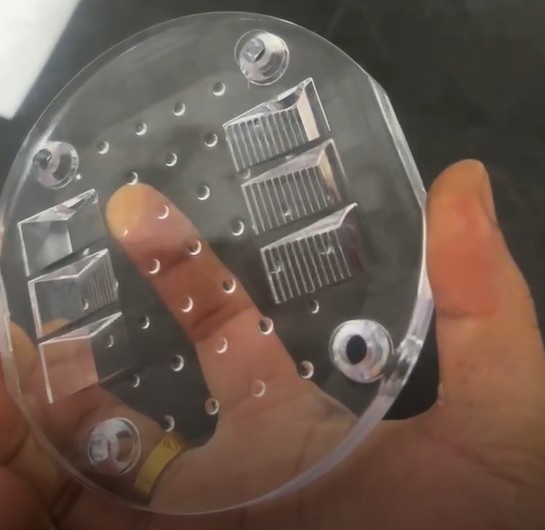 Custom CNC machined plastic component, showcasing the ability to produce complex, low-volume functional parts.