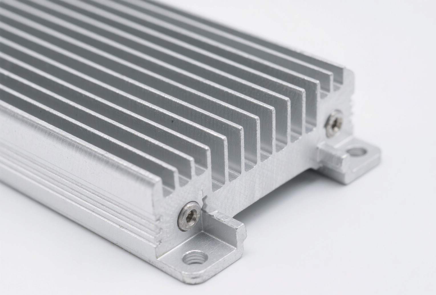CNC machined end plates and components for an extruded aluminum battery tray, ensuring structural integrity and coolant channel sealing.