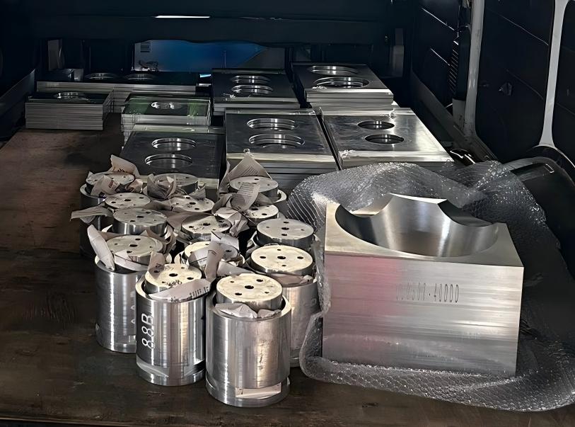 Finished and packaged components being securely loaded onto a truck for shipment, the final step in our quality chain.