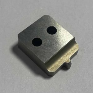 CNC machined stainless steel knob or handle with knurled grip, offering durability and a professional aesthetic.
