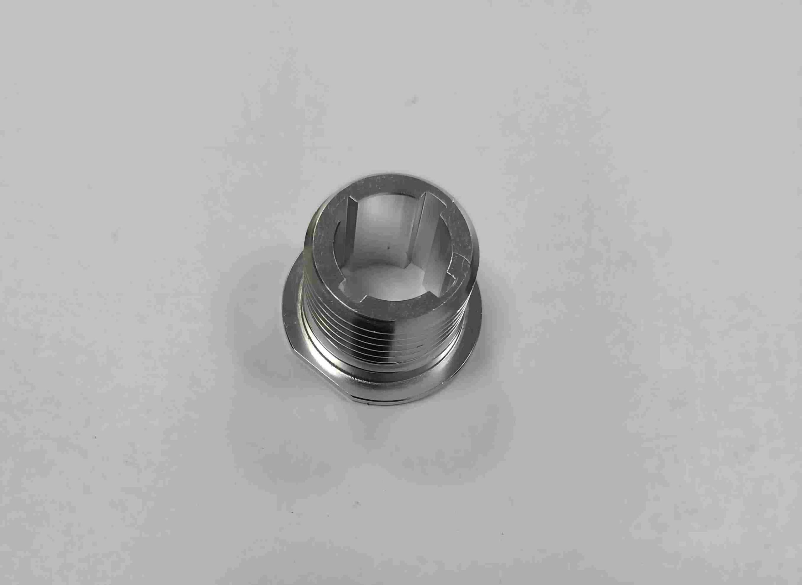 Precision stainless steel spacer or bushing, manufactured on a CNC lathe for accurate positioning in machinery assemblies.