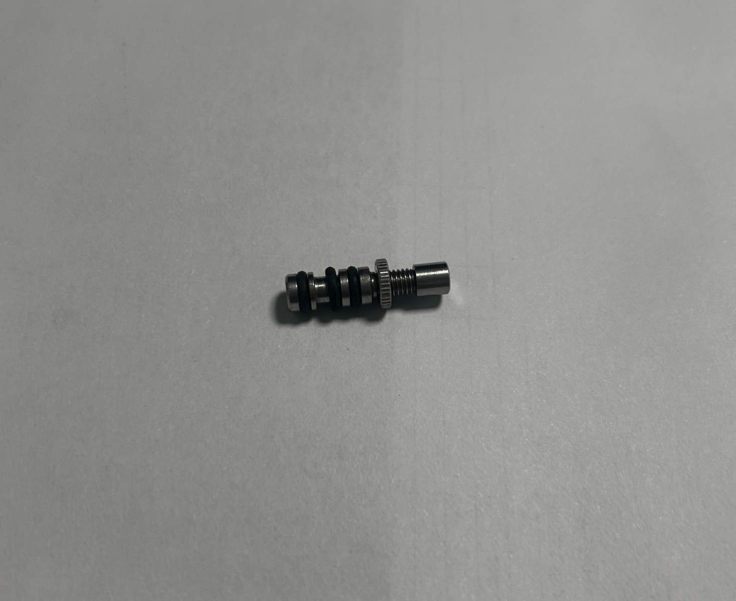 Precision CNC machined metal plunger valve stem with O-rings, custom stainless steel sealing component for industrial equipment, threaded metal fitting with seals