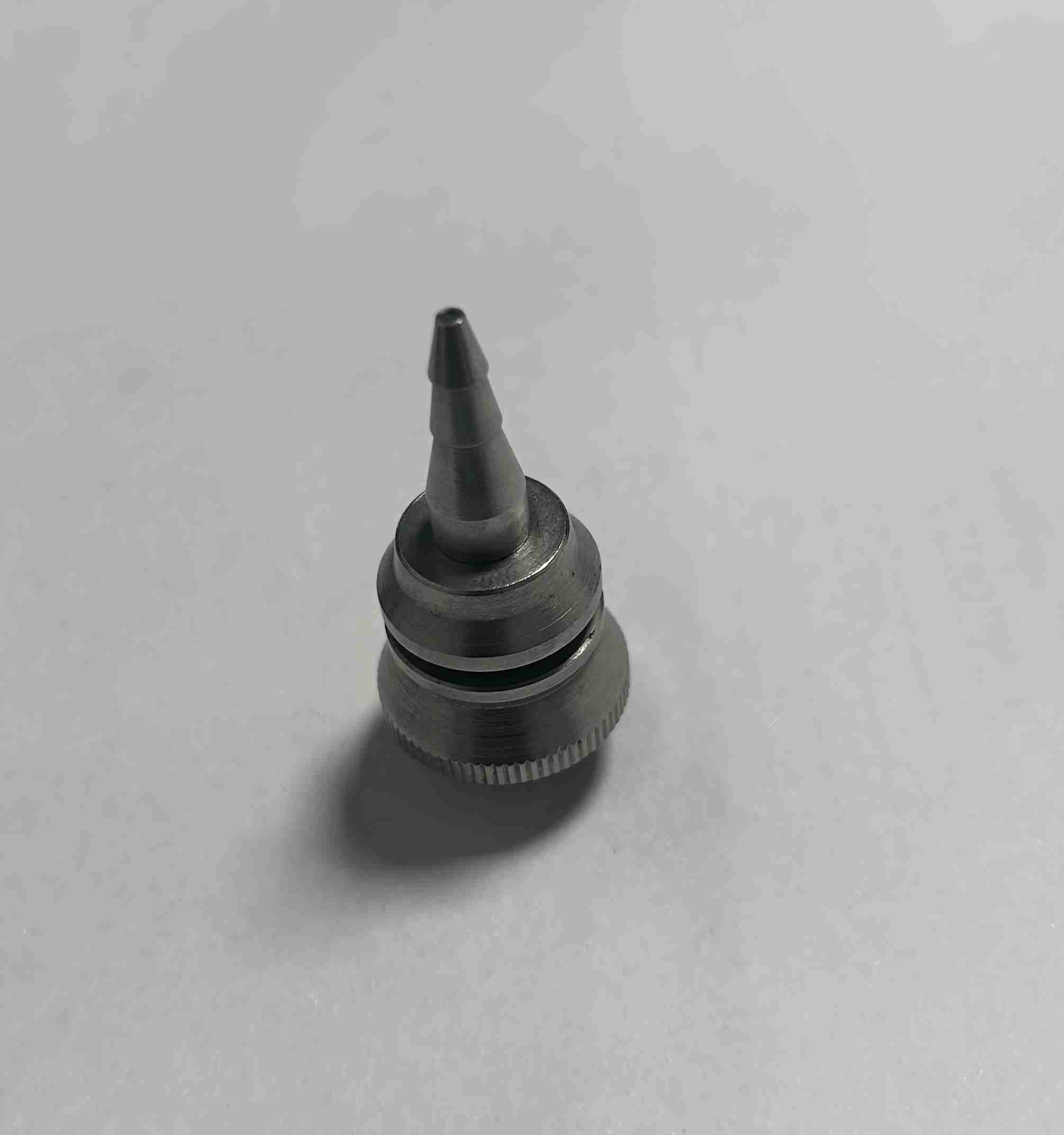 Custom CNC machined conical metal nozzle, precision stainless steel fluid connector for industrial equipment, knurled metal fitting with multi-stage taper